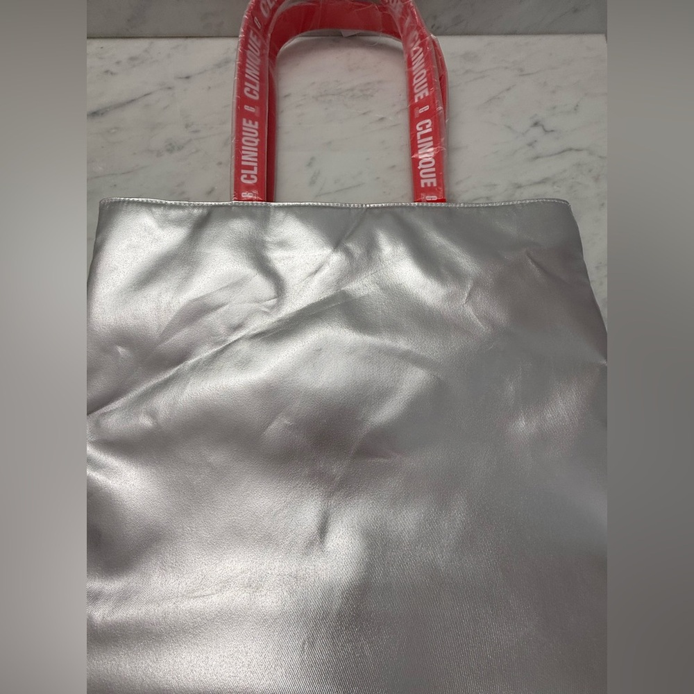 Clinique Metallic Silver Tote with Red Logo Handles